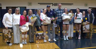 Hood River Valley volleyball seniors pose with their parents before senior night this year