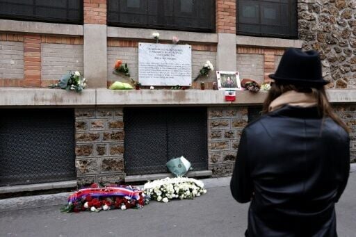 A commemorative plaque for those killed at the Paris bar La Belle Equipe