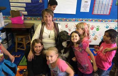 Therapy dog bonds with kids