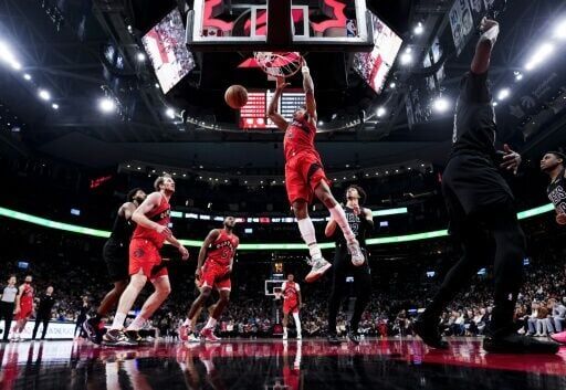 Scottie Barnes of the Toronto Raptors dunks in the Raptors' NBA victory over the Brooklyn Nets
