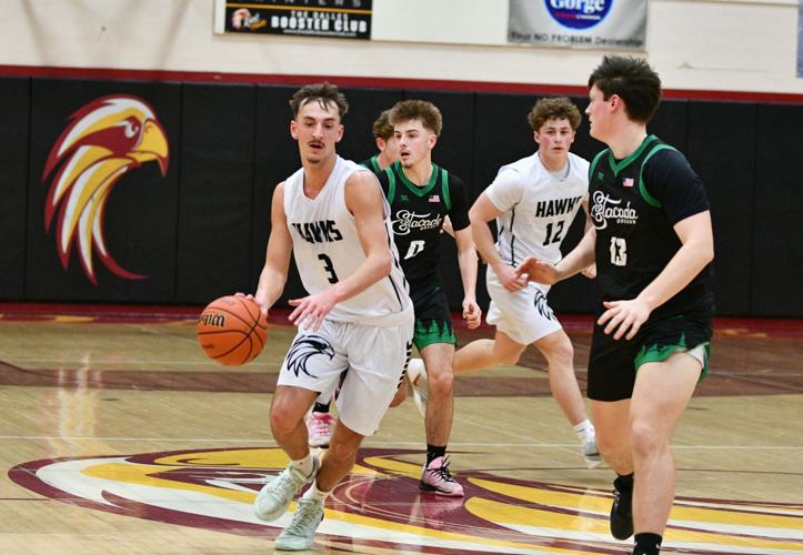 Derek Goulart (3) attacks the basket against Estacada earlier this year.