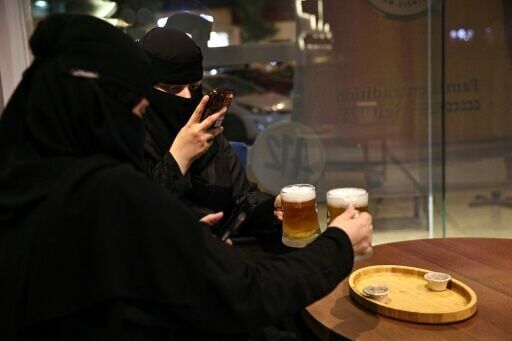 Saudi women enjoy alcohol-free draft beer at the A12 cafe in Riyadh