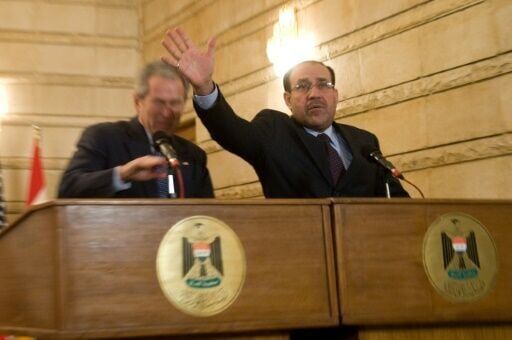 Then prime minister Nouri al-Maliki tries to block a shoe being thrown at then US president George W. Bush in 2009