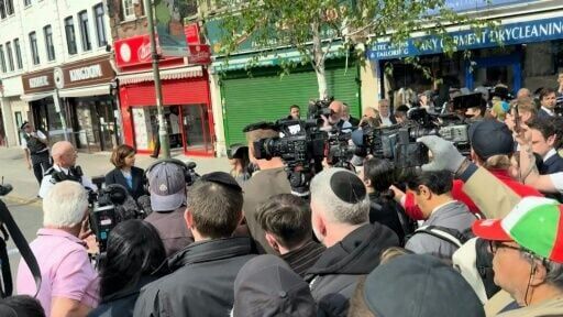 Londoners chant 'shame on you' at site of stabbing of two Jews