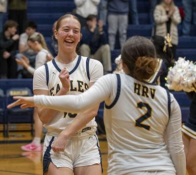 Emily Doss (10) and Tess Balzer (2) dance as the starting lineup is announced during a game last year.