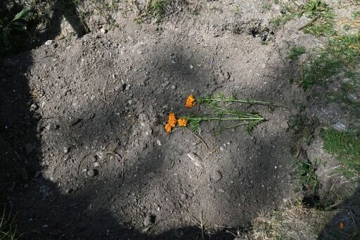 Flowers have been place on a mass grave at a cemetery in Mexico City, where thousands of unidentified bodies have been buried