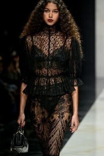 The designers heavily tapped black lace and sheer silk organza, allowing for ample glimpses of skin