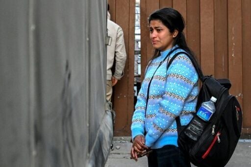 Those left behind: a relative of Nepali migrant worker Rudra Bahadur Kami sheds a tear as his body is repatriated