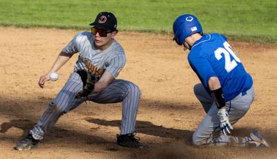 Evan Ortega (14) makes the tag at second base against Valley Catholic on March 18.