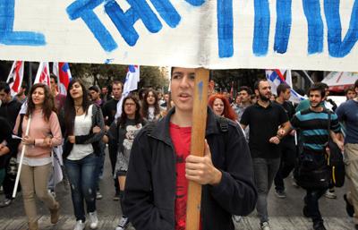 Greek unions protest cuts