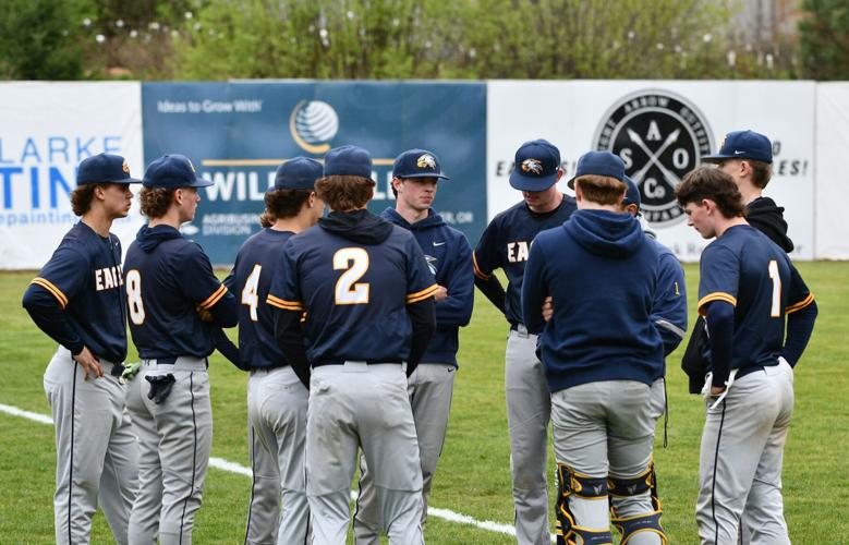 The Hood River Valley High School baseball team meets before a game earlier this year.