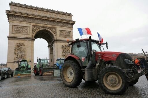 Dozens of tractors arrived before dawn and drove through Paris