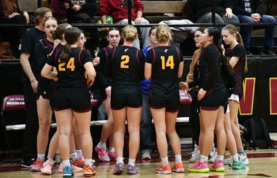 The Dalles girls basketball team during a timeout against Molalla on Feb. 27.