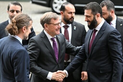 Syrian President Ahmed al-Sharaa is welcomed by German Foreign Minister Johann Wadephul ahead of a German-Syrian roundtable meeting
