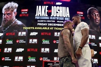 Jake Paul (left) and Anthony Joshua (right) face off at a press conference ahead of their Netflix-backed heavyweight fight next month