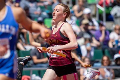 The Dalles' Zoe Dunn crosses the finish line