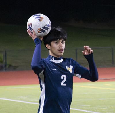 Miguel Lopez (2) throws the ball in for Hood River Valley boys soccer against La Salle on Oct. 8.  Zach Thummel photo