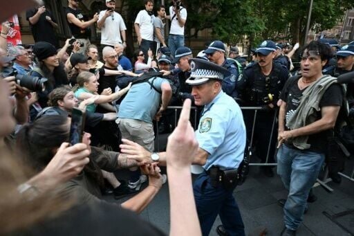 Police scuffle with pro-Palestinian protesters during a demonstration in Sydney against Israeli President Isaac Herzog's visit to Australia