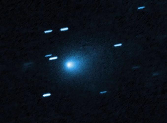 Why did hostile alien spaceship comet dramatically brighten?