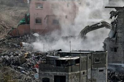 Israeli military excavators are tearing down residential buildings in the Nur Shams camp for Palestinian refugees