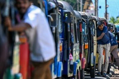 Drivers queue to refuel rickshaws at a fuel station on the outskirts of the Sri Lankan capital, as the war's economic impact mounts worldwide