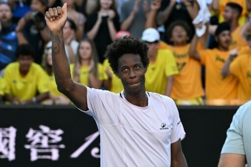 Gael Monfils acknowledges the crowd after losing to Australia's Dane Sweeny