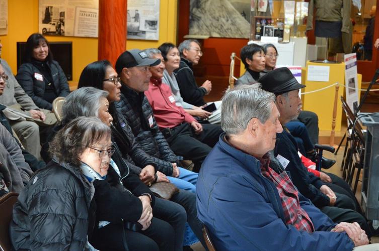 Invited guests listen to special presentations during the Dec. 3 History Museum event. Trisha Walker photo