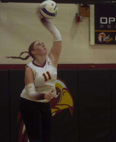 Caitlynn Gatton (11) serves the ball for The Dalles against Molalla