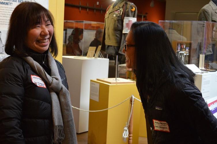 Marcy Hasegawa and Jackie Hasegawa catch up after the Dec. 3 presentation at the History Museum of Hood River County. Trisha Walker photo