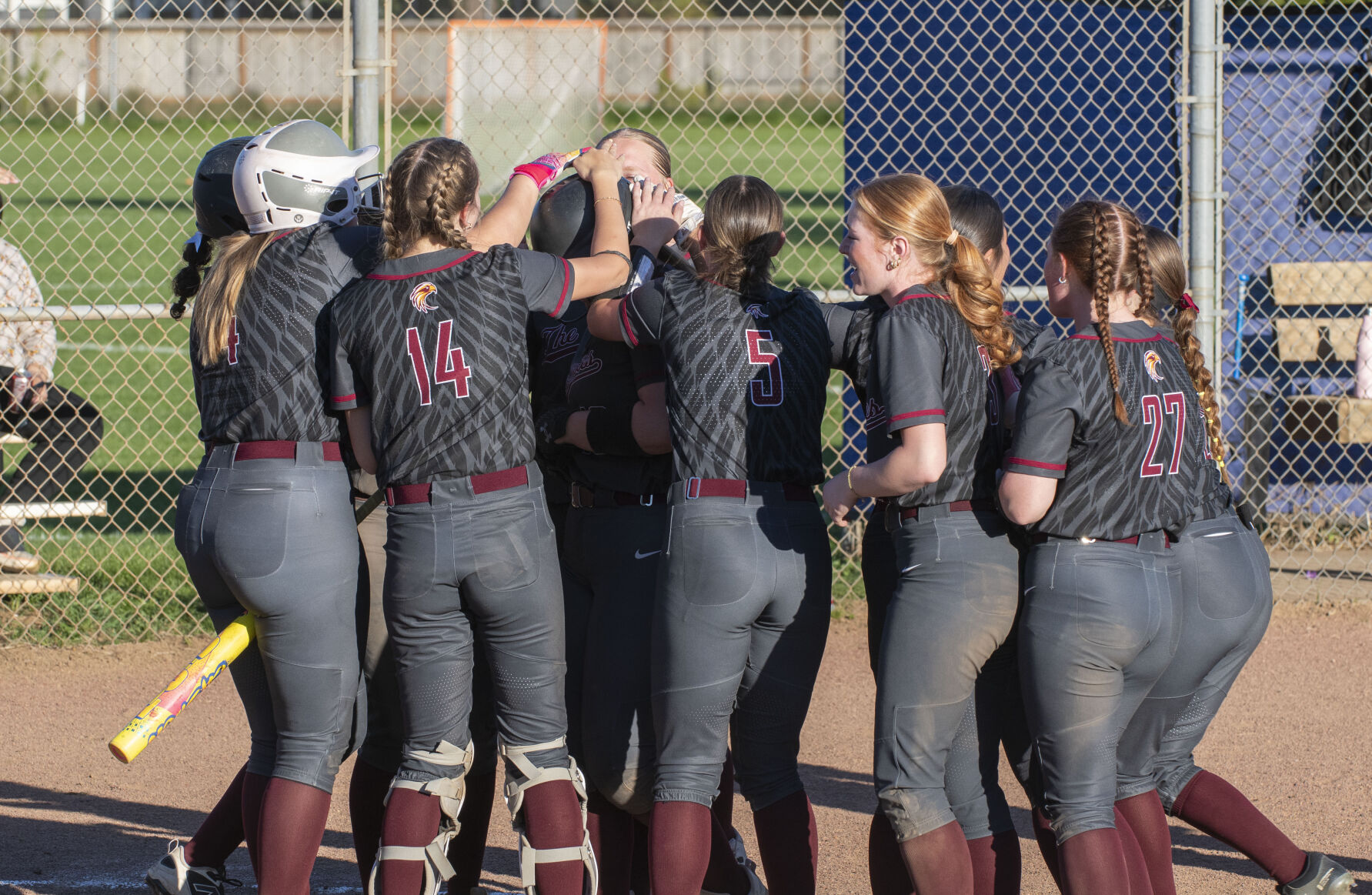 The Dalles softball team celebrates a run earlier this year.