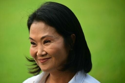 On the day of Peru's presidential election, top candidate Keiko Fujimori visits the Lima cemetery where her father, former president Alberto Fujimori, is buried