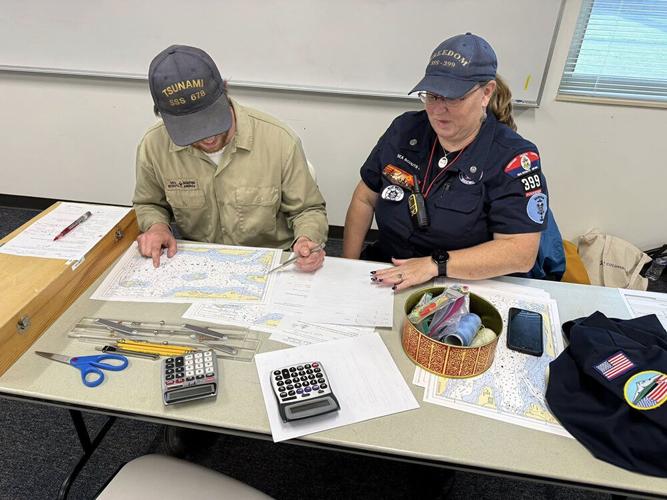 Skipper Deidre Baumgarten and colleague oversee the piloting/navigation event