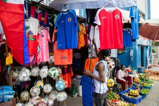 A vendor seeling football jerseys and balls in Petion-Ville, a suburb of Port-au-Prince