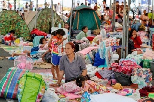Evacuated Thai residents at a temporary shelter in Buriram province