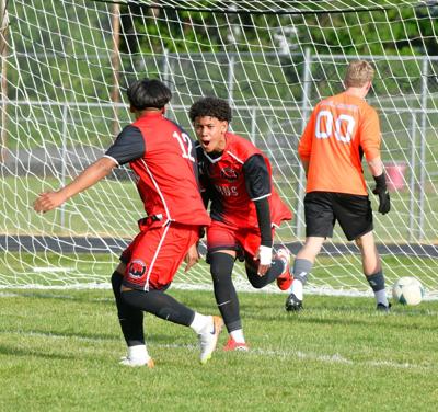 Bruin  eighth-grader Estiven Hernandez Pena (17) celebrates after his goal with sophomore Orlem Chamonica. Hernandez Pena had two goals for the Bruins on the night.