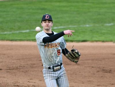 Riverhawk freshman Thatcher Dray (8) firses a ball to first base against Sweet Home earlier this year.