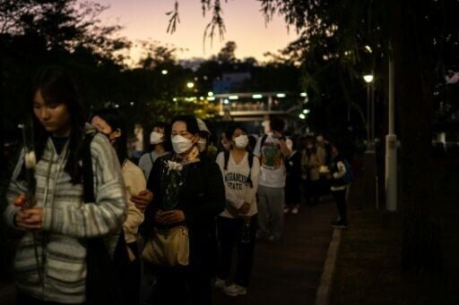 The queue of mourners outside Hong Kong's Wang Fuk Court was so long that people had to wait hours to pay their respects