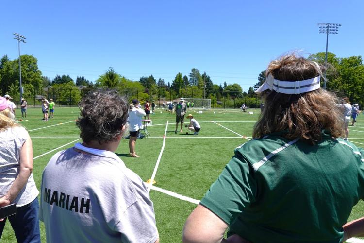 Mariah and Jayne standing by while Refs measure their roll.jpg