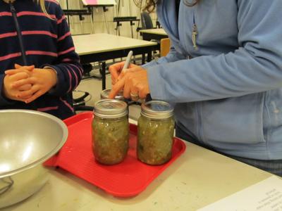 OSU Extension Master Food Preservers make tomatillo/green tomato salsa.