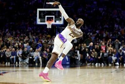 Lebron James of the Los Angeles Lakers reacts after shooting a three-pointer in the second half of an NBA win over the Philadelphia 76rs