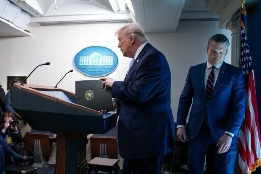 President Donald Trump and US Secretary of War Pete Hegseth arrive for a news conference