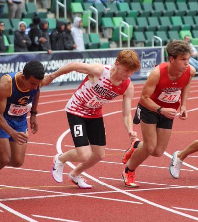 Horizon Christian’s Josh Carley (center) and Dufur’s Zeb Stelzer break at the start of the 1500-meter run at the 2026 OSAA Class 1A state track and field meet at historic Hayward Field in Eugene May 29. Both runners raced to personal bests at state.