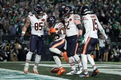 Kyle Monangai of the Chicago Bears celebrates after scoring a touchdown in an NFL victory over the Philadelphia Eagles