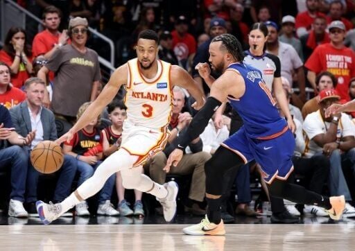 CJ McCollum of the Atlanta Hawks drives against Jalen Brunson in the Hawks' win over the New York Knicks in game three of their NBA playoff series