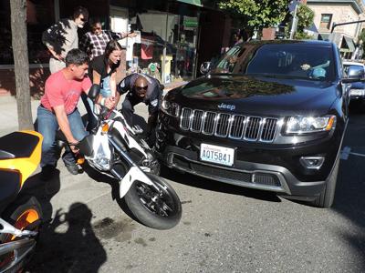 Unoccupied car knocks down two cycles