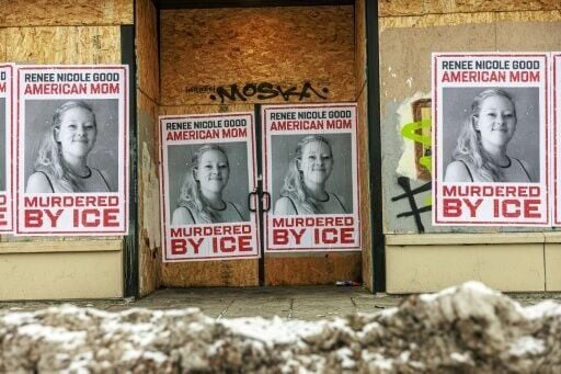 Businesses boarded up in parts of Minneapolis display posters of Renee Nicole Good following her fatal shooting by a federal agent
