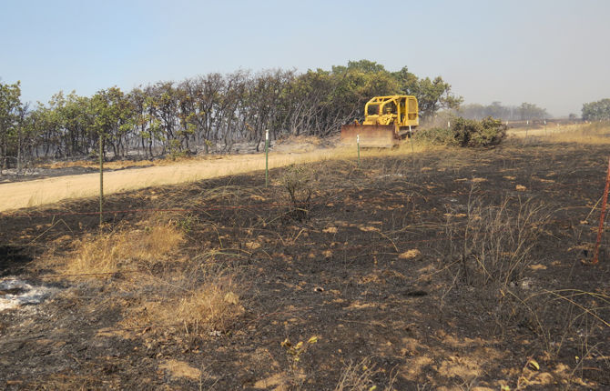 Obrist Road evacuated as fire escalates