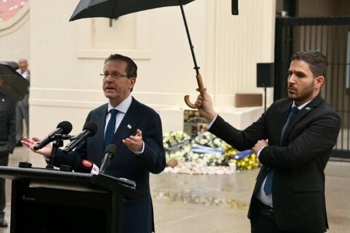 Israeli President Isaac Herzog pays homage to victims of the Bondi Beach attack