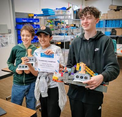 Team United Robotics left to right: Ronan Kairis, Vivaan Sharma and Euan O'Brien.