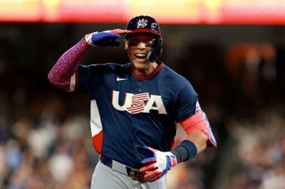 Aaron Judge celebrates his two-run home run in the USA's World Baseball Classic victory over Brazil